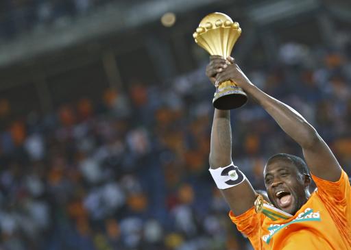 Ivory Coast's captain Yaya Toure raises the trophy after winning the African Nations Cup final soccer match against Ghana in Bata