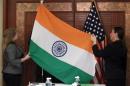 Technical Sergeant Taylor and Guinn from the U.S.   Department of Defense display the flags of India and the United States before a   bilateral meeting in Singapore