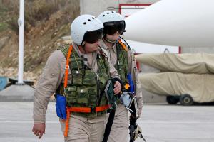 Russian air force pilots arrive to board a Russian &hellip;