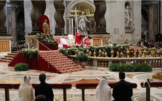 Pope Francis officiates a mass at the wedding of 20 couples in St.Peter's Basilica at the Vatican