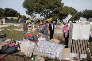 Palestinian Bedouins inspect the remains of makeshift &hellip;