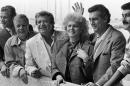 FILE - In this May 15, 1986 file photo, from left, Italian film director Franco Zeffirelli, Israeli Producer Menahem Golan, opera singer Katia Ricciarelli and Mexican Singer Placido Domingo in Cannes, for the screening of their film "Otello" in competition in the 39th Cannes film festival. Golan, a veteran Israeli filmmaker who produced some of the biggest action movies of the 1980s, has died in Tel Aviv. He was 85. (AP Photo/Michel Lipchitz, File)