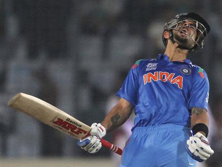 Virat Kohli celebrates after India won the semi final ... - 450 x 338 jpeg 19kB