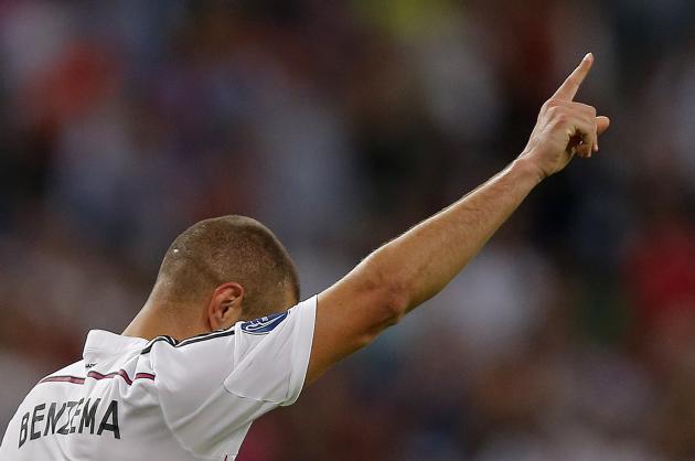 Real Madrid's Karim Benzema celebrates after scoring his side's fifth goal during the Champions League Group B soccer match between Real Madrid and Basel at the Santiago Bernabeu stadium in Madrid, Sp