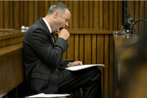 Oscar Pistorius yawns as he listens to evidence in court for his ongoing murder trial in Pretoria, South Africa, Friday, May 9, 2014. Pistorius is charged with the shooting death of his girlfriend Reeva Steenkamp on Valentine's Day in 2013. (AP Photo/Herman Verwey, Pool)
