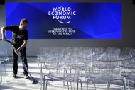 A worker vacuum-cleans the carpet inside the Congress Center ahead of the 47th annual meeting of the World Economic Forum, WEF, in Davos, Switzerland, Monday, Jan. 16, 2017. (Laurent Gillieron/Keystone via AP)