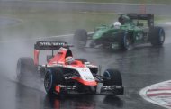 French driver Jules Bianchi leads Japanese driver Kamui Kobayashi at the Japanese Grand Prix in Suzuka on October 5, 2014