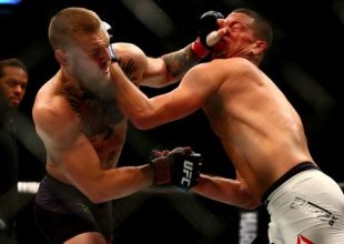 Conor McGregor and Nate Diaz trade blows during their UFC 196 fight. (Reuters)