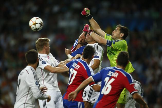 Real's Iker Casillas tries to push the ball away during the Champions League Group B soccer match between Real Madrid and Basel at the Santiago Bernabeu stadium in Madrid, Spain, Tuesday, Sept. 16, 20