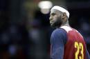 Cleveland Cavaliers' LeBron James stands on the court during an NBA scrimmage basketball game Wednesday, Oct. 1, 2014, in Cleveland