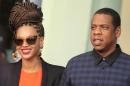 U.S. singer Beyonce and her husband rapper Jay-Z walk as they leave their Hotel in Havana