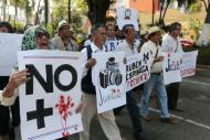 Mexican journalists take part in a demonstration protesting against the murder of photojournalist Ruben Espinosa, in Acapulco, Guerrero state, Mexico, on August 4, 2015