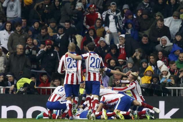 GRA366. MADRID, 15/01/2015.- Los jugadores del Atlético de Madrid celebran el segundo gol marcado al Real Madrid, obra de Fernando Torres, durante el partido de vuelta de los octavos de final de la Co