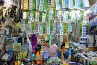 A vendor looks out from his electronics stall in a market in Shanghai on August 15, 2013. Unofficial electronic chargers often do not meet essential safety requirements and are sometimes made of inferior plastics and other insulation materials