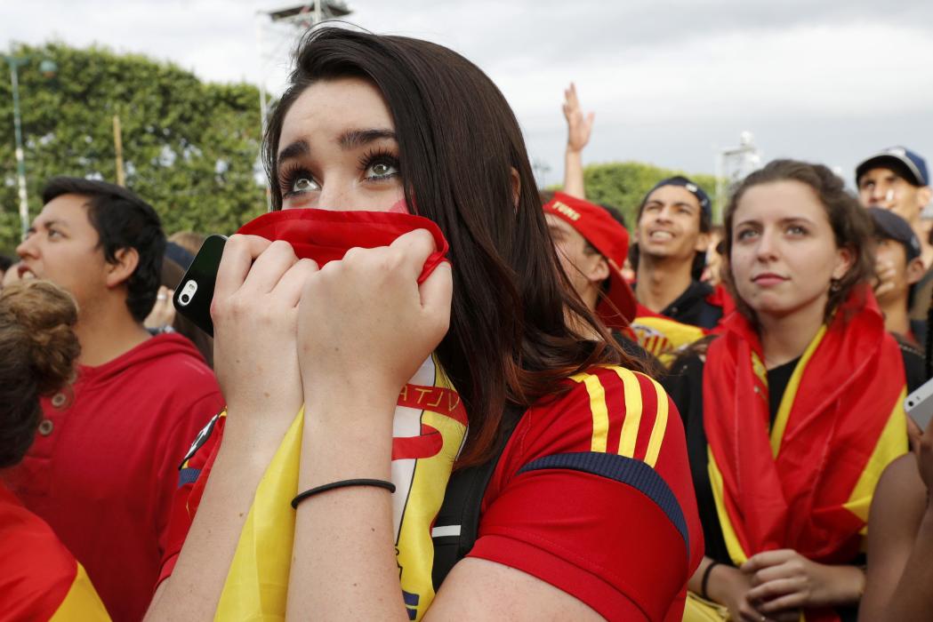 Spain fans react in the fan zone as they watch a EURO 2016 Round of 16 soccer match in Paris