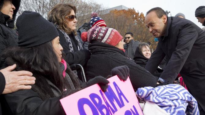 Rep. Luis Gutierrez, D-Ill.,  right, speaks with Lenka Mendoza, of Dumfries, Va., who is originally from Peru and has two children who qualified for DACA, during a rally in support of executive action addressing immigration reform, Wednesday, Nov. 19, 2014, in front of the White House in Washington. Mendoza has been fasting for reform for 17 days.   (AP Photo/Jacquelyn Martin)