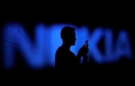 Nokia hit by weak wireless market, says awaiting merger benefits