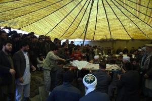 Afghan mourners surround the bodies of members of a &hellip;