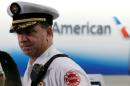 Chicago Fire Department Assistant Deputy Fire Commissioner Timothy Sampey holds a news conference about an American Airlines jet that caught fire at O'Hare International Airport in Chicago