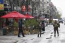 Belgian soldiers patrol in central Brussels after   security was tightened in Belgium following the fatal attacks in Paris