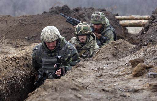 Ukrainian soldiers take part in military exercises near the eastern Ukrainian city of Schastya, in the Lugansk region on March 3, 2015