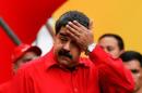 Venezuela's President Nicolas Maduro wipes his   face while he speaks during a pro-government rally in Caracas