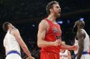 Chicago Bulls' Pau Gasol (16), of Spain, reacts after dunking the ball during the first half of an NBA basketball game against the New York Knicks, Wednesday, Oct. 29, 2014, in New York