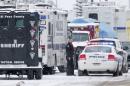 A police officer stands outside one of multiple   vehicles from the city of Colorado Springs and El Paso County at a mobile command   post outside the Planned Parenthood clinic in Colorado Springs, Colorado