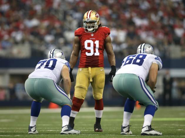 San Francisco 49ers defensive end Ray McDonald (91) stands at the line of scrimmage over Dallas Cowboys' Zack Martin (70) and Doug Free (68) during the second half of an NFL football game, Sunday, Sep