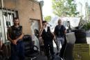 Armed men stand inside the Erebuni police station   seized by "Sasna Tsrer" movement members in Yerevan
