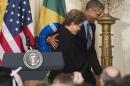 US President Barack Obama (R) and Brazilian President Dilma Rousseff leave following a joint press conference in the East Room of the White House in Washington, DC, June 30, 2015