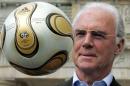 Franz Beckenbauer, President of Germany's World   Cup organising committee, plays with a golden soccer ball