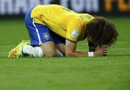 Brazil's David Luiz reacts after their 2014 World Cup semi-finals against Germany at the Mineirao stadium in Belo Horizonte July 8, 2014. REUTERS/Ruben Sprich
