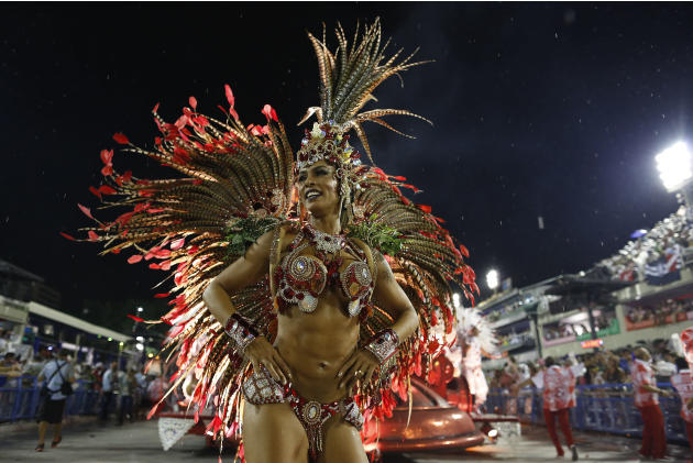 A performer from the Salgueiro samba school parades during carnival celebrations at the Sambadrome in Rio de Janeiro, Brazil, Monday, Feb. 16, 2015. (AP Photo/Leo Correa)