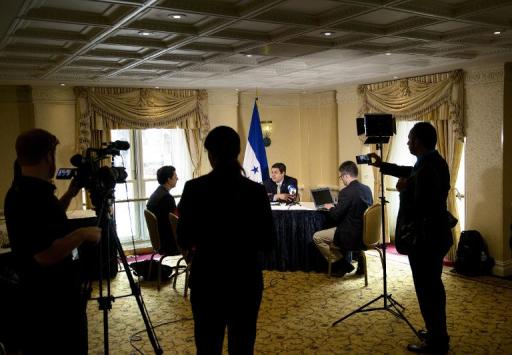 President of Honduras Juan Orlando Hernandez speaks to reporters on June 17, 2015 in Washington, DC