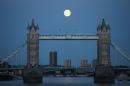 A supermoon rises over Tower Bridge in London