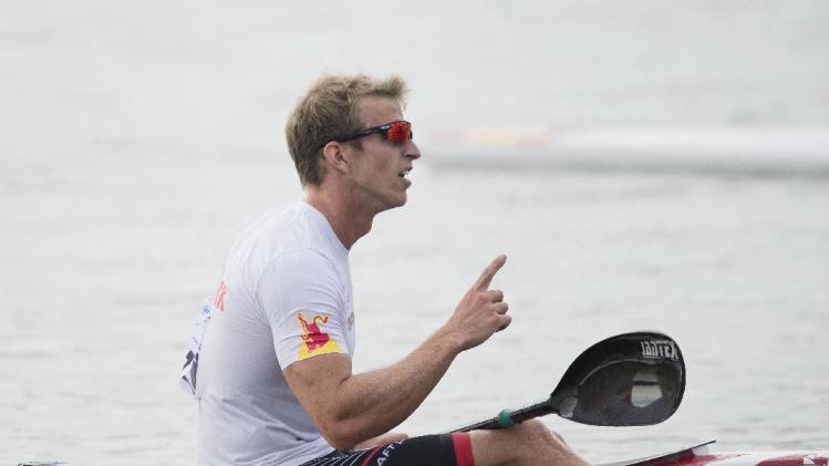 celebrates after winning the K1 men 500m final of the ICF Canoe 