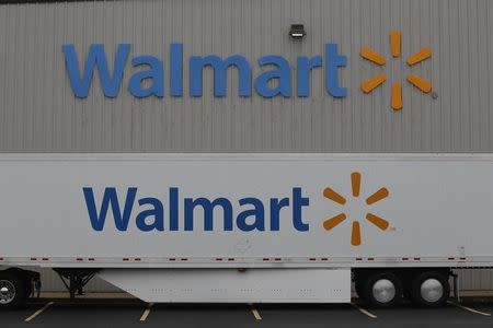 The Wal-Mart company logo is seen outside a Wal-Mart Stores Inc company distribution center in Bentonville, Arkansas June 6, 2013. REUTERS/Rick Wilking
