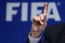 Re-elected FIFA President Blatter gestures during a   news conference after an extraordinary Executive Committee meeting in Zurich