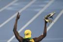 El jamaiquino Usain Bolt festeja tras ganar los 100 metros en los Juegos Olímpicos de Río de Janeiro el domingo, 14 de agosto de 2016. (AP Photo/Martin Meissner)