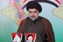 Prominent Iraqi Shi'ite cleric Moqtada al-Sadr   delivers a statement in Najaf