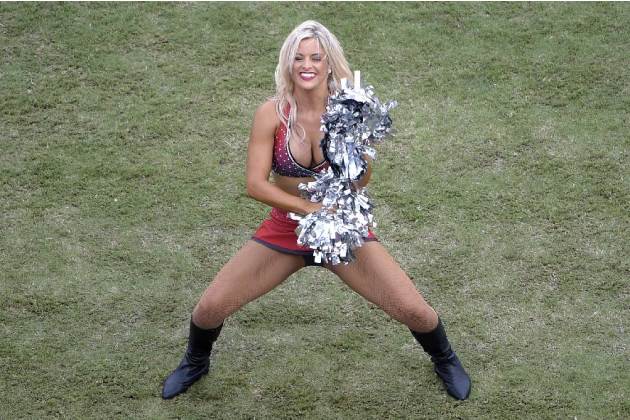 A Tampa Bay Buccaneers cheerleader performs during the first half of an NFL football game against the St. Louis Rams in Tampa, Fla., Sunday, Sept. 14, 2014.(AP Photo/Phelan M. Ebenhack)