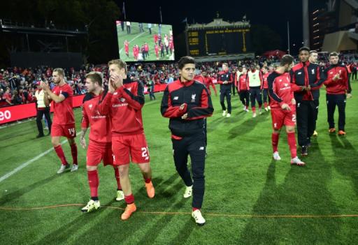 Liverpool players celebrate victory after their international friendly football match agaisnt Adelaide United in Adelaide on July 20, 2015