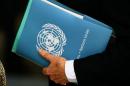 United Nations Special Envoy for Syria de Mistura   holds a folder aside of the 31st Session of the Human Rights Council in Geneva