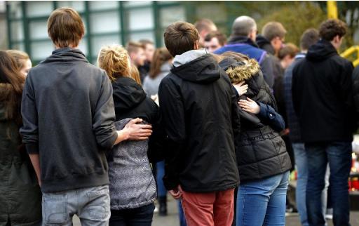 Students and well-wishers gather in front of the Joseph Koenig Gymnasium secondary school in Haltern am See, Germany on March 24, 2015