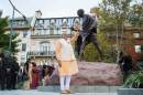 Modi waves to supporters after paying homage at the Mahatma Gandhi Statue in front of the Indian Embassy in Washington
