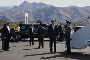 President Obama grins on the tarmac at Palm Springs International Airport in February 2014. 