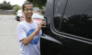 Ahmed Mohamed, the 14-year-old who was arrested at MacArthur High School after a homemade clock he brought to school was mistaken for a bomb, smiles before before leaving his family's home Wednesday, Oct. 21, 2015, in Irving, Texas. Mohamed will soon be leaving Irving with his family to move to the Middle Ease to attend school. Mohamed's family said in a statement Tuesday that they've accepted a foundation's offer to pay for his high school and college in Doha, Qatar. (AP Photo/LM Otero)