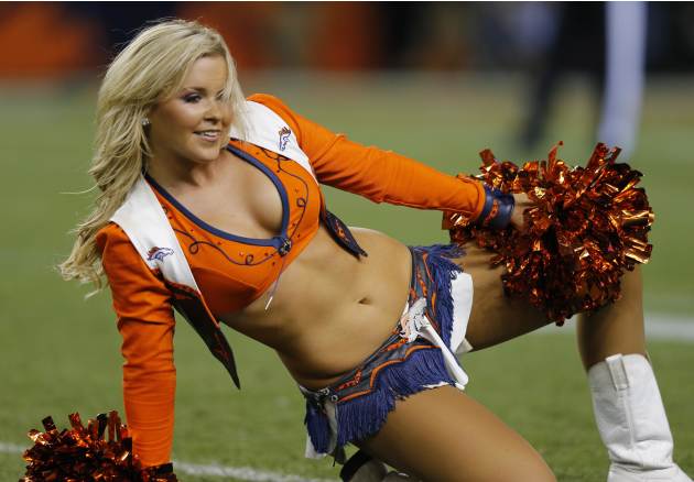 A Denver Broncos cheerleader performs during the second half of an NFL football game against the Indianapolis Colts, Sunday, Sept. 7, 2014, in Denver. (AP Photo/Jack Dempsey)