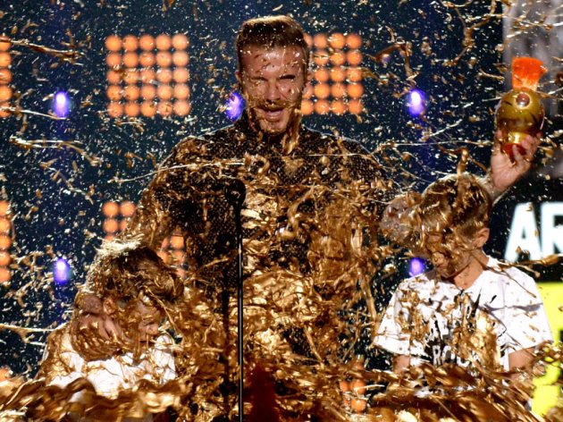 Cruz David Beckham, David Beckham and Romeo James Beckham get slimed onstage during Nickelodeon Kids' Choice Sports Awards 2014 on July 17, 2014 in Los Angeles -- Getty Images